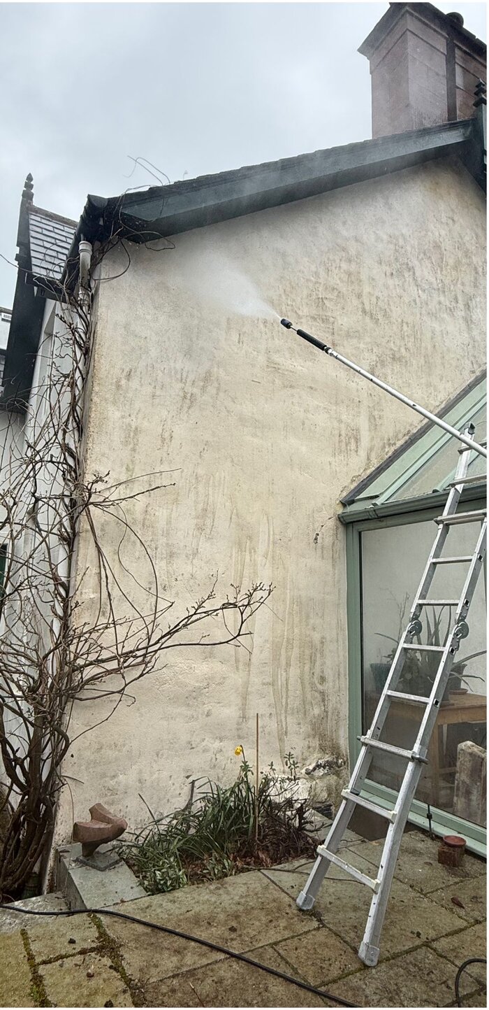 The same gable wall clean and even after a soft wash